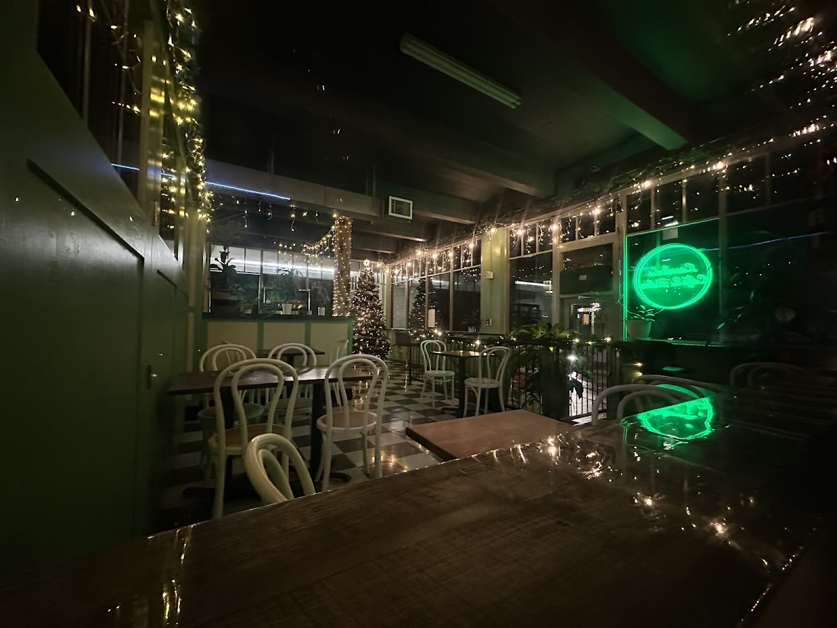 The cafe at night, warm with fairy lights and string lights